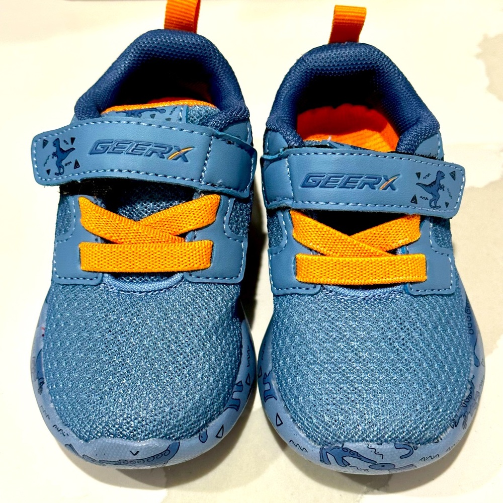 NIB blue dinosaur toddler boy sneakers. Size 5t. Non slip lightweight breathable